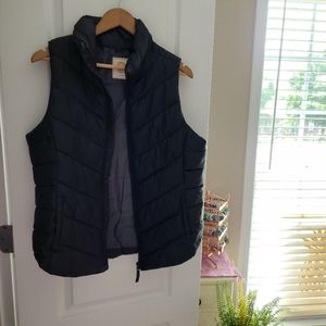 Black puffy vest.